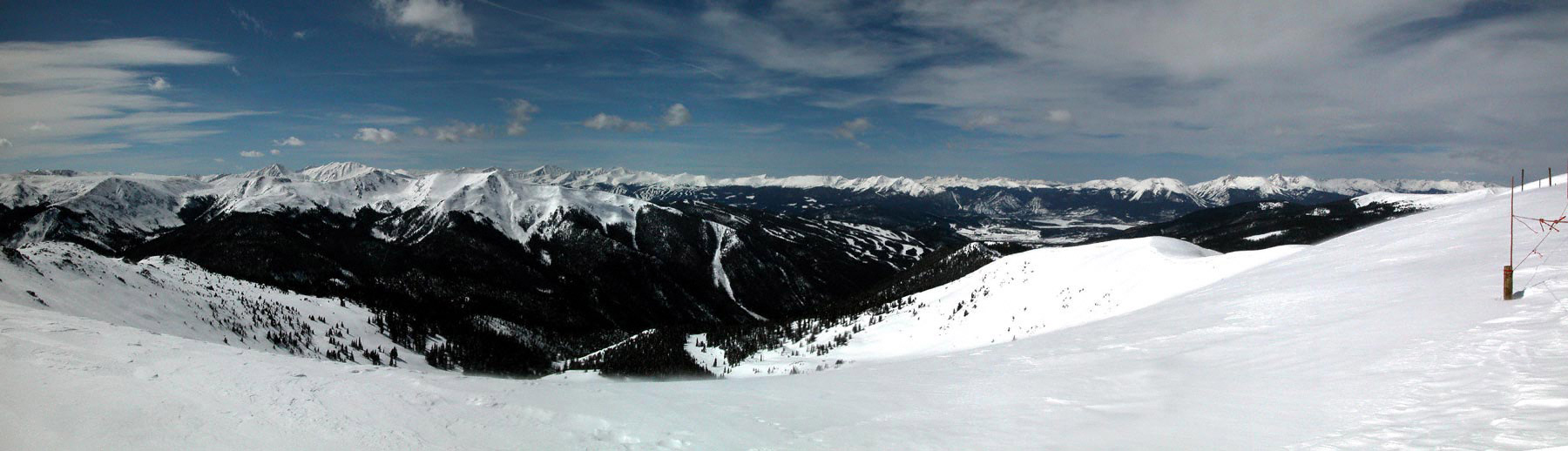 View from the top of ABasin looking west.  The closest ski runs are Keystone, the ones in the distance are Breckenridge.  Digital Image - March 2003